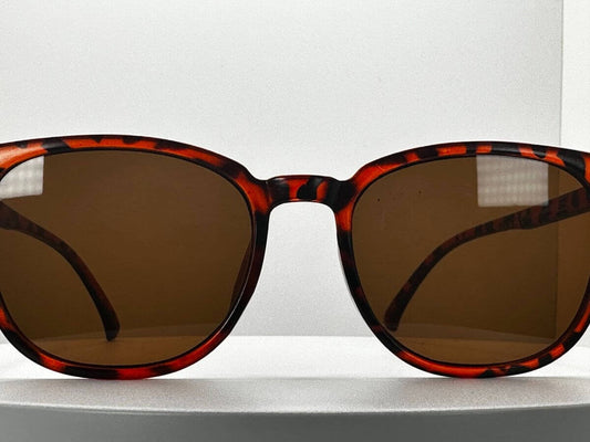 Bold tortoiseshell oversized sunglasses with brown lenses, perfect for summer 2025 fashion.